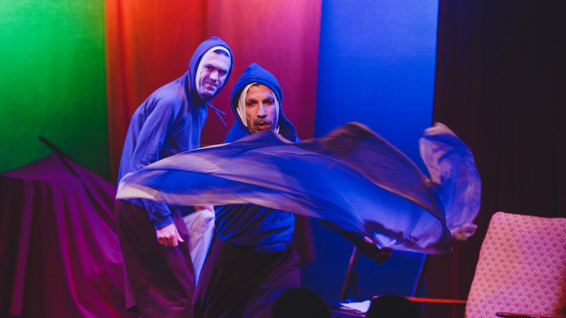 two people performing in theatre