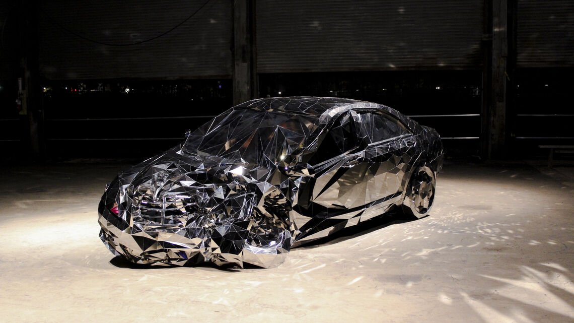 sculpture of wrecked car