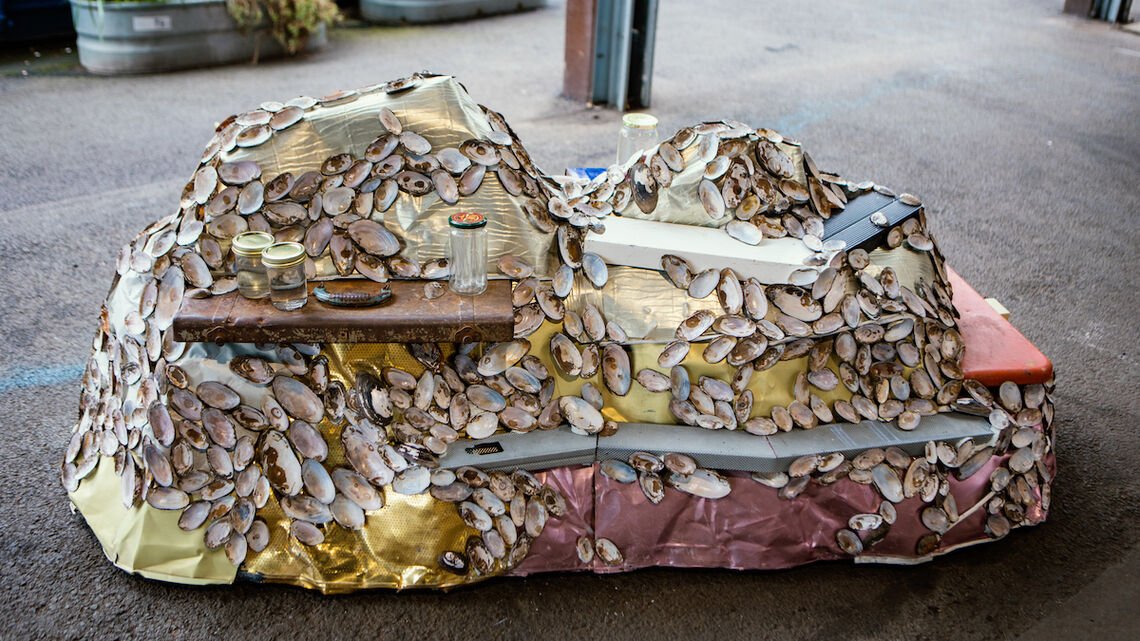 Stand alone sculpture featuring reclaimed materials and mussel shells