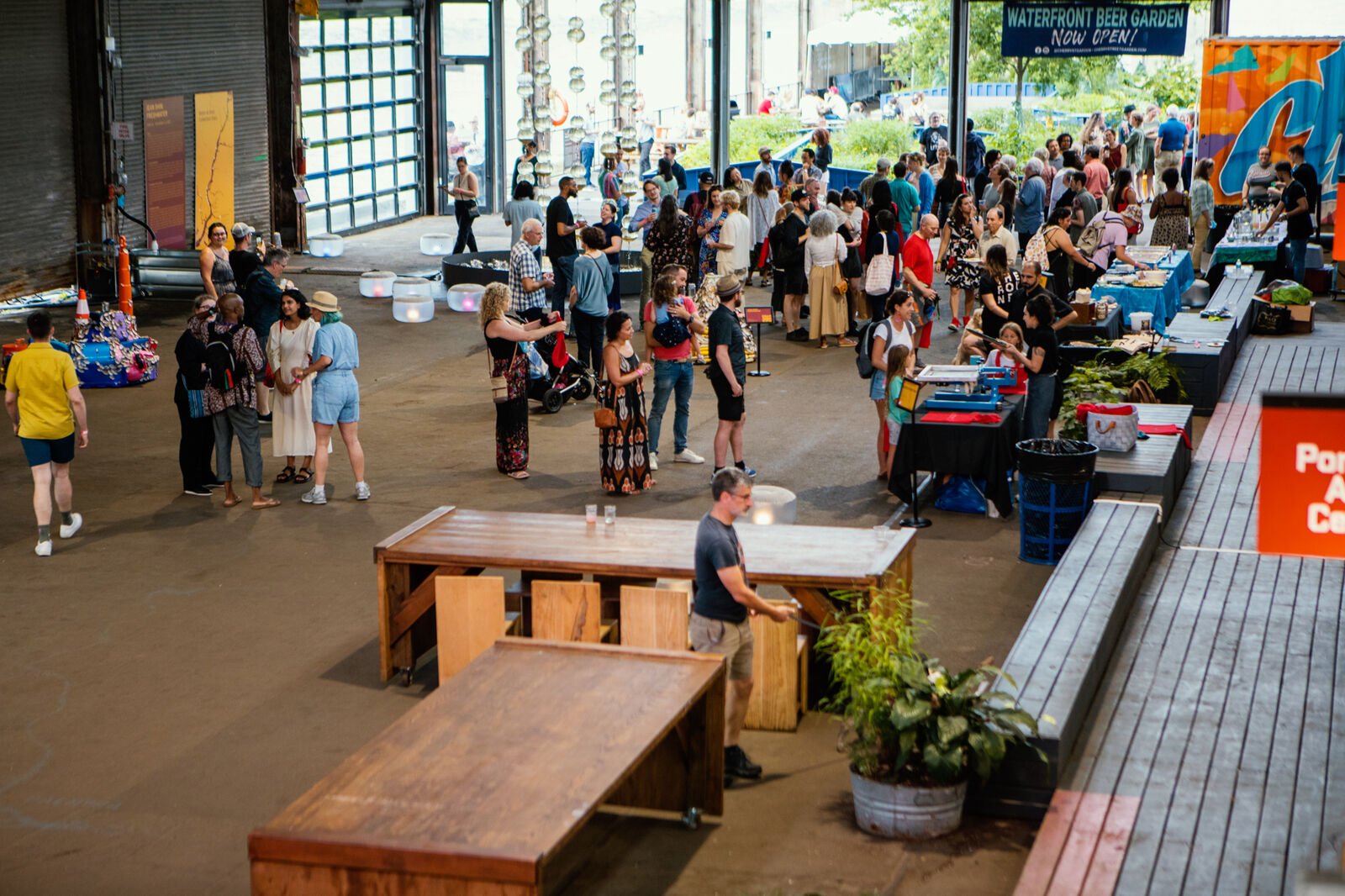 Guests inside Cherry Street Pier during Freshwater's opening reception